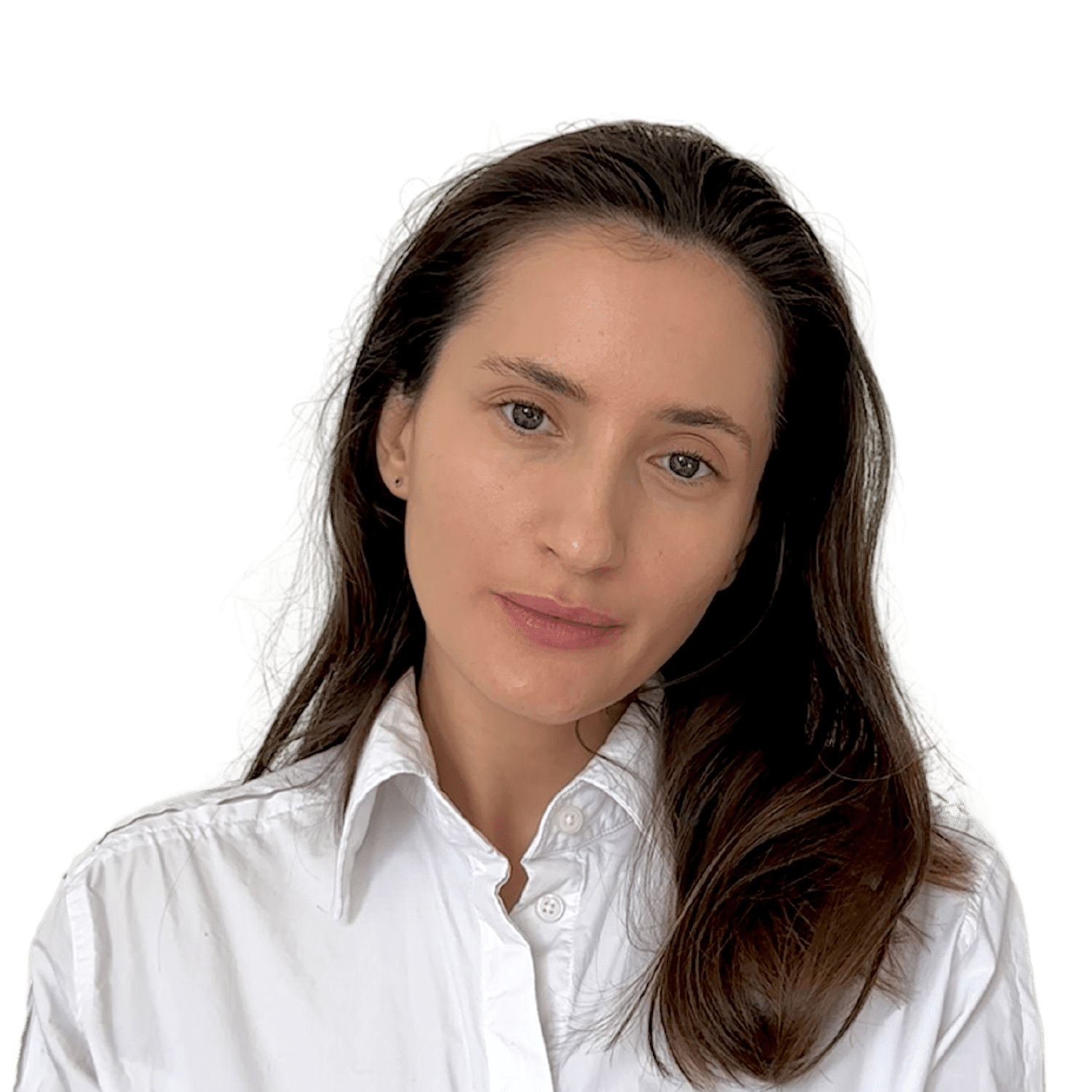 A woman with long brown hair is wearing a white button-up shirt. She is looking directly at the camera against a plain background.